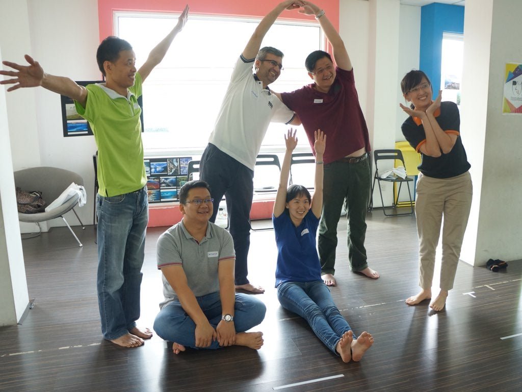Participants in an Enfiniti PLAY! drama game